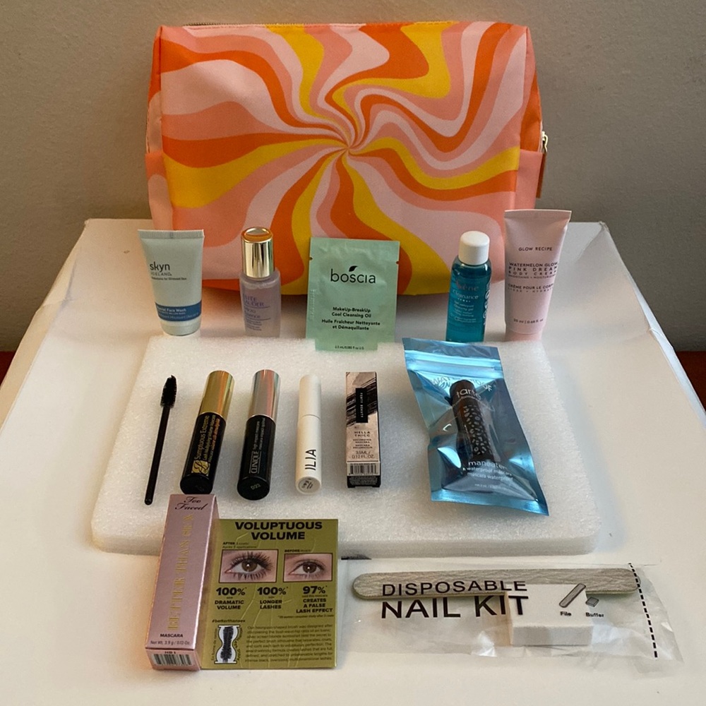 - New NIB 6 travel size mascaras and makeup removers. With top zip pouch